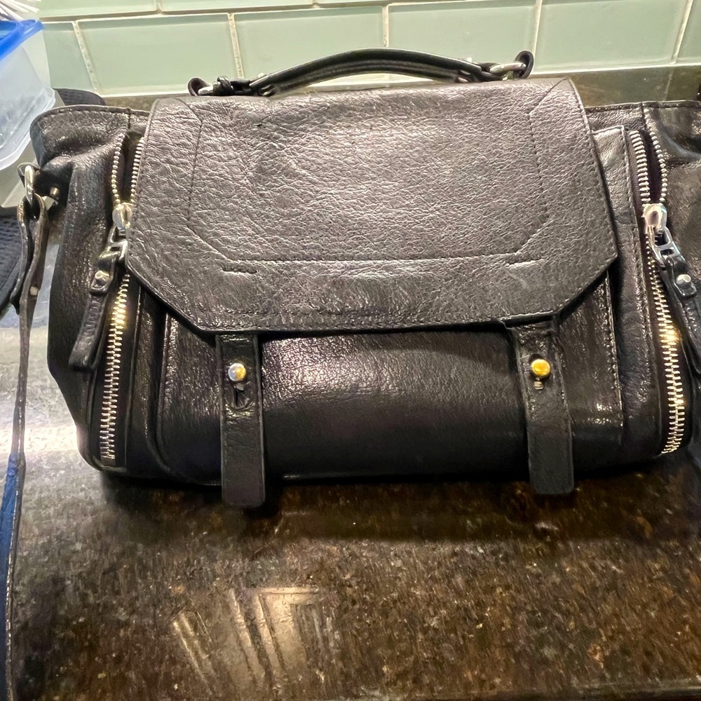 Gorgeous,  up to the moment, black leather handbag.